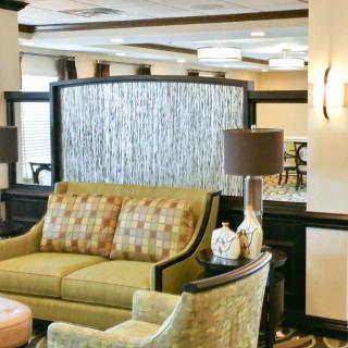 A cozy lobby area with comfortable seating and elegant decor.