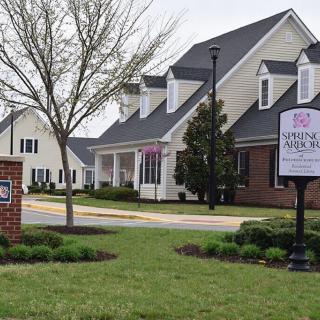 A view of a suburban neighborhood with modern houses and well-maintained landscaping.