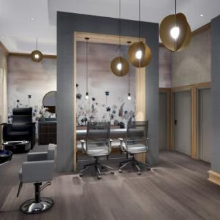 A modern salon interior with stylish chairs and contemporary lighting.