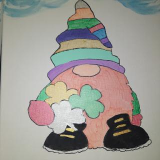 A whimsical gnome character, adorned with a vibrant rainbow hat and playful accessories.