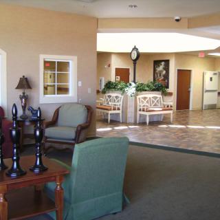 A cozy lobby area with comfortable seating and decorative elements.