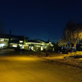 A scenic view of a well-lit residential area at night.