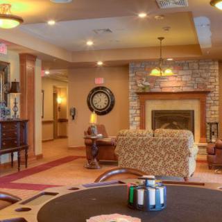 A cozy living room with a fireplace and comfortable seating.