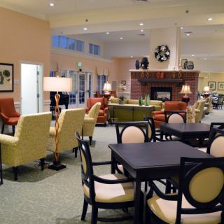 A spacious lounge area featuring comfortable seating and elegant decor.
