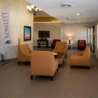 A cozy lobby with comfortable seating arrangements and warm lighting.