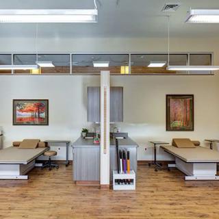A modern physical therapy clinic with treatment beds and a welcoming environment.