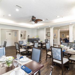 Elegant dining area with neatly set tables and comfortable seating.
