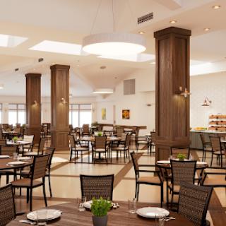 A modern restaurant interior featuring a spacious dining area with elegant wooden furniture and bright lighting.