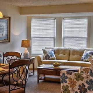 Cozy living room with a dining area and natural lighting.
