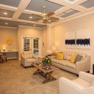 A cozy living room with modern furniture and warm lighting.