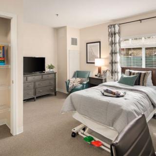 A cozy, modern bedroom with stylish furniture and decor.