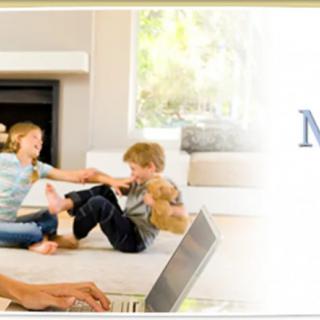 A cozy living room scene with children playing while an adult uses a laptop.
