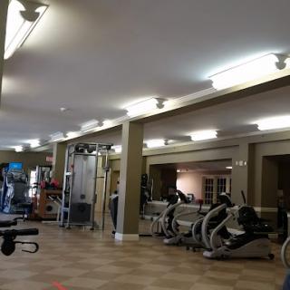 A well-equipped gym with various exercise machines and equipment.