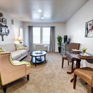 A cozy living room with elegant furniture and tasteful decor.