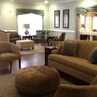 A cozy living room with comfortable seating and soft lighting.