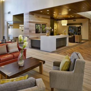A modern lobby with a seating area featuring contemporary furniture and elegant interior design.