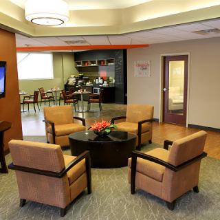 A cozy waiting area featuring comfortable seating and a modern aesthetic.