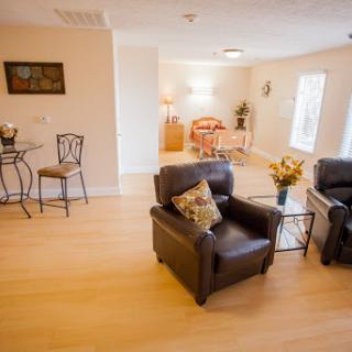A cozy and inviting living room setup featuring comfortable seating and stylish decor.