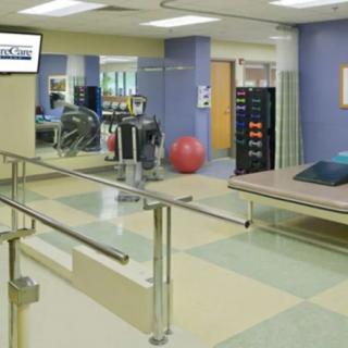A rehabilitation facility featuring exercise equipment and therapy areas.