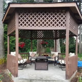 A cozy gazebo set in a peaceful outdoor area, perfect for relaxation.