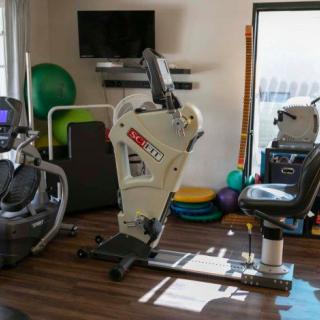 A well-equipped gym featuring various exercise machines and fitness tools.