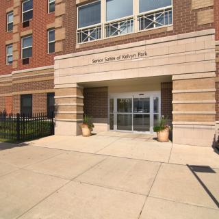 The front entrance of a multi-story residential building.