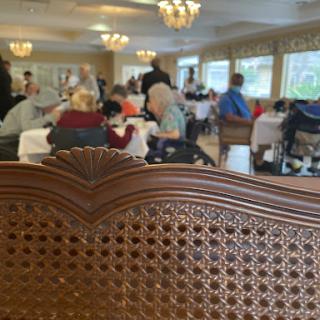 A bustling dining area filled with people enjoying their meals and socializing.