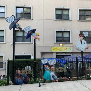 A vibrant community mural celebrating education and childhood, featuring playful decorations and engaged children.