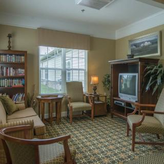 Cozy living room with comfortable seating and a television.