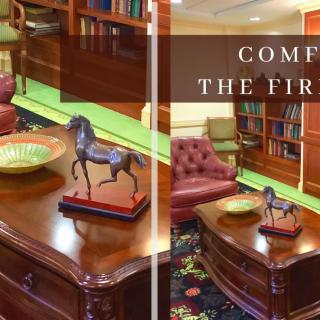 A cozy library interior with comfortable seating and decorative elements.