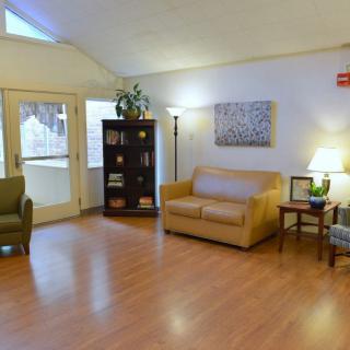 A cozy living room with comfortable furniture and warm lighting.