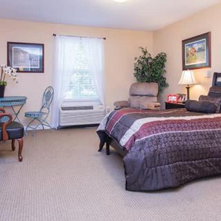 A cozy bedroom with a comfortable bed and stylish decor.