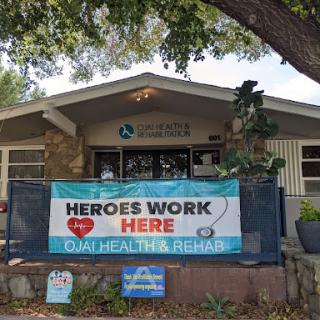 A welcoming facility featuring a banner that says 'Heroes Work Here' at Dual Health & Rehab.