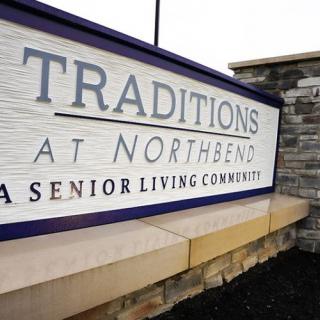Sign for Traditions at Northbend, a senior living community.