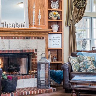 A cozy living room with a fireplace and elegant decor.