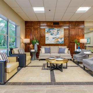 A modern living room with elegant furniture and decorative accents.