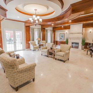 Luxurious lounge area with elegant seating and a fireplace.