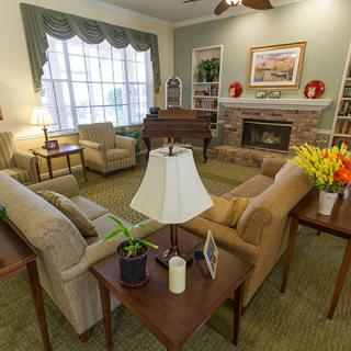 A cozy living room featuring comfortable seating and a fireplace.
