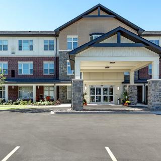 A modern residential building with a welcoming entrance and well-maintained facade.