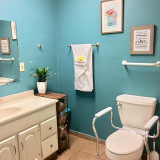 A bright and inviting bathroom with blue walls and modern fixtures.
