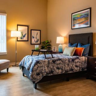 A cozy bedroom with stylish decor and comfortable furnishings.