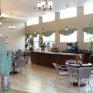 A bright and airy cafe interior with modern furniture and decor.