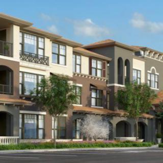 Modern apartment building with multiple levels and decorative balconies.