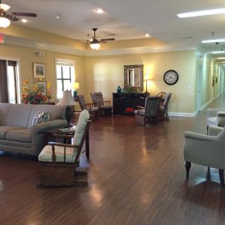 A cozy living room with comfortable seating and warm lighting.