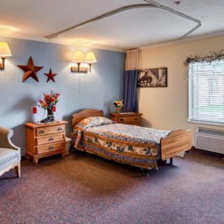 A cozy bedroom with a single bed and warm decor.