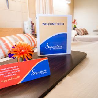 A warm welcome display featuring a 'Welcome Soon' sign and elegant decor in a hospitality setting.