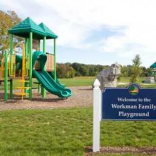 A sunny day at the Wexham Family Playground featuring a green slide.