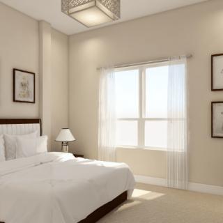 A minimalist bedroom with neutral tones and natural light.