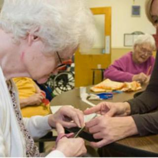 Elderly individuals engaging in a group activity at a nursing home.