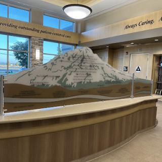 A beautifully designed lobby featuring a striking mountain sculpture as a centerpiece.